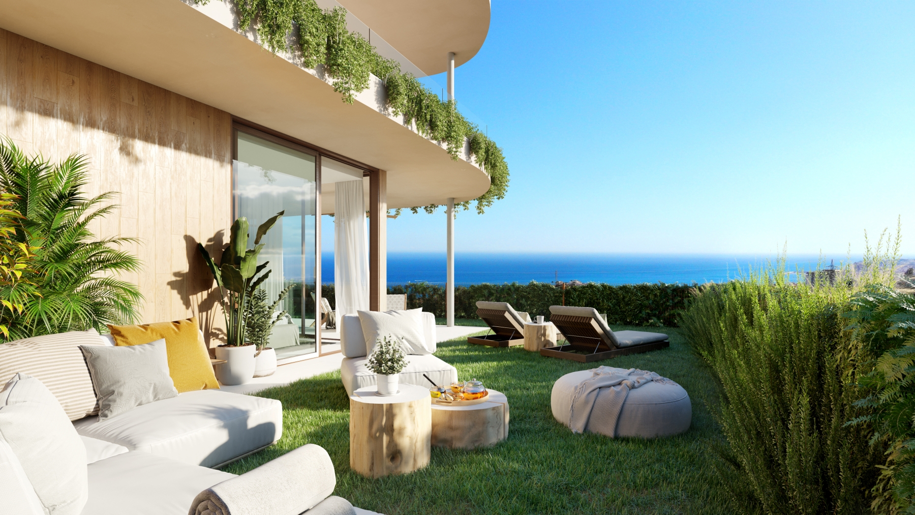 Private garden terrace with sea views and outdoor lounge furniture